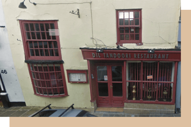 An outside image of the shop front taken in early 2000's. The shop name is Dil Tandoori Restaurant.